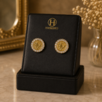 Goldfarbene Pfund-Design-Ohrringe mit Fawaris